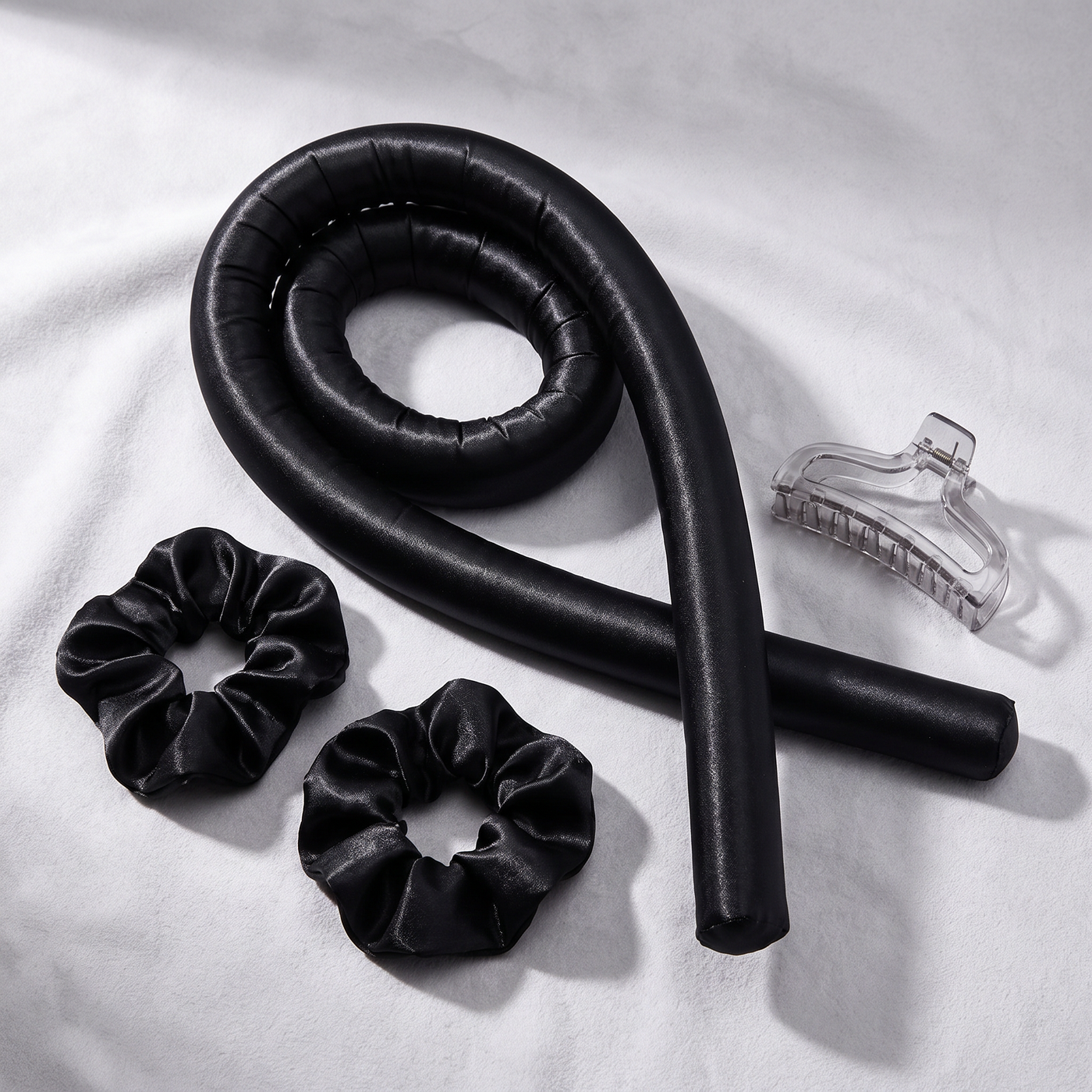 Revonae heatless curling rod set in glossy black satin